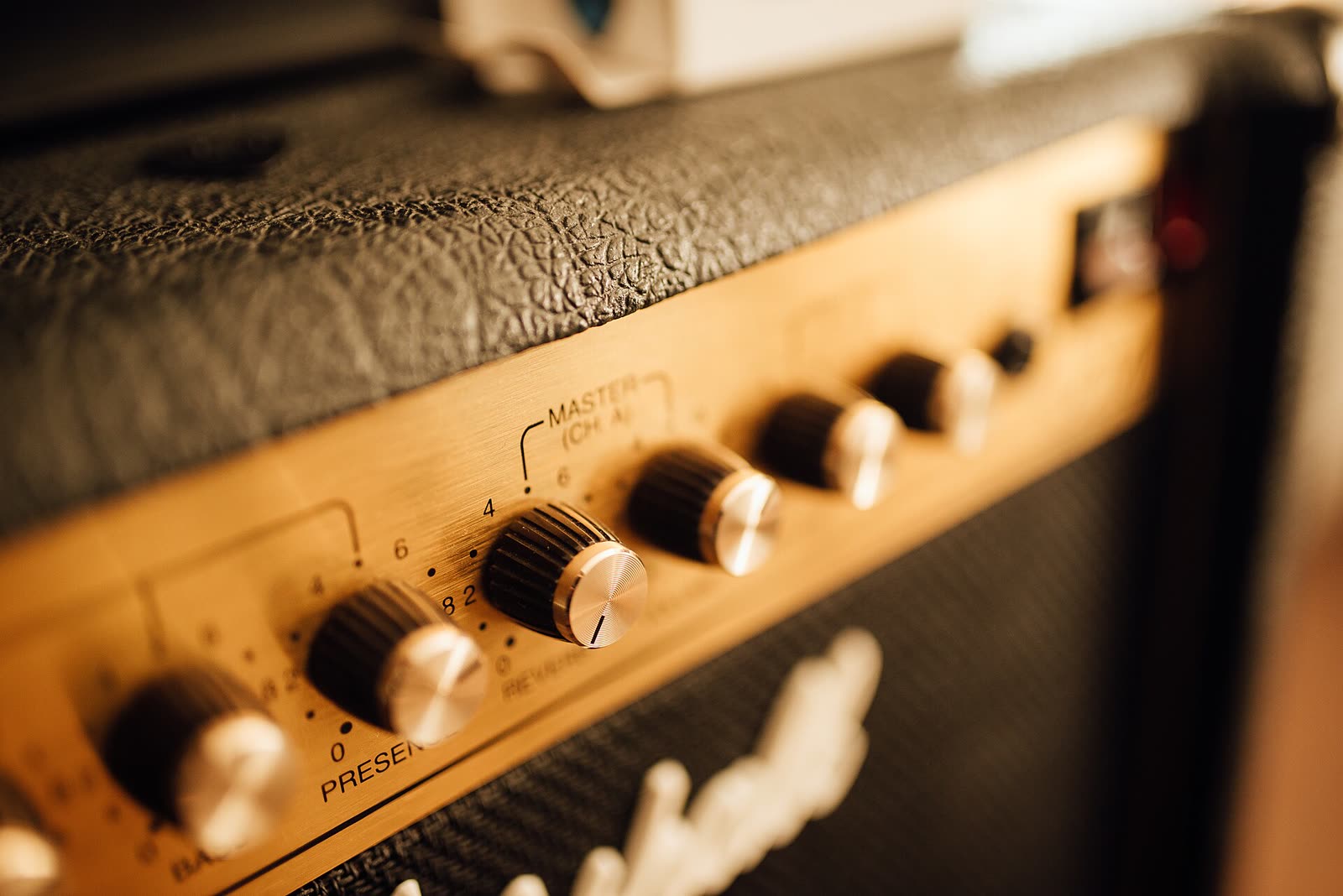 The knobs of a guitar amplifier, close up